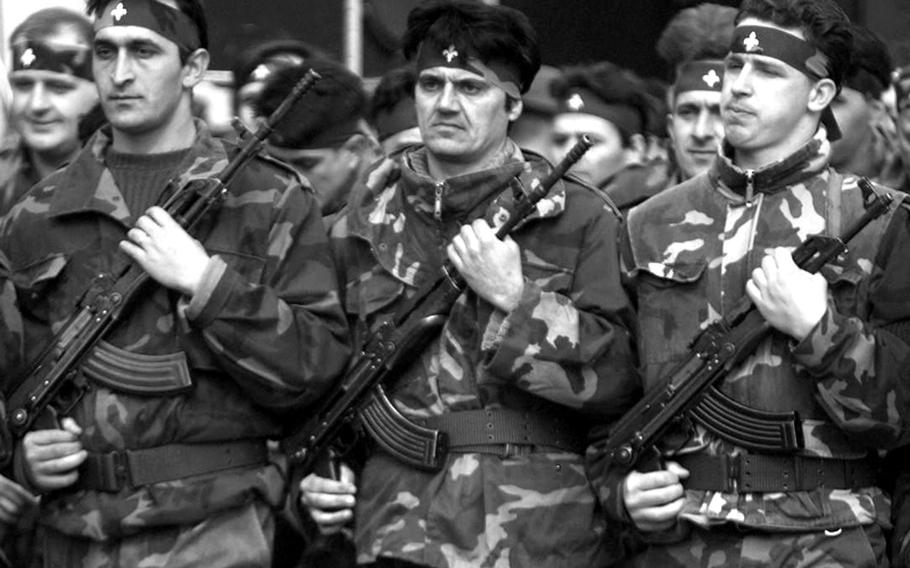 Members of the Bosnian army march through Tuzla's stadium during Independence Day ceremonies on March 1, 1996.