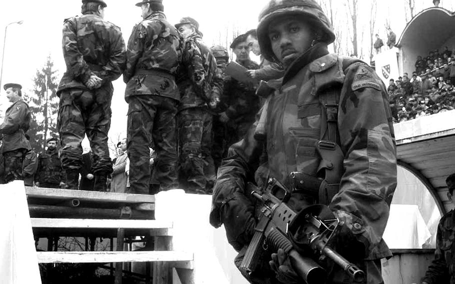Sgt. Jeffrey Hunter of the 501st Military Police company out of Baumholder, Germany, provides security for the American delegation to the Bosnian Independence Day celebration at Tuzla's stadium on March 1, 1996.