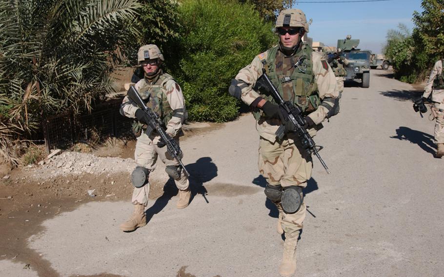 Soldiers from the 2nd Brigade Combat Team, 1st Infantry Division patrol Iraq in 2004. The brigade will be teaming up with AFRICOM for rotational missions that will train and send small units to Africa as needed.