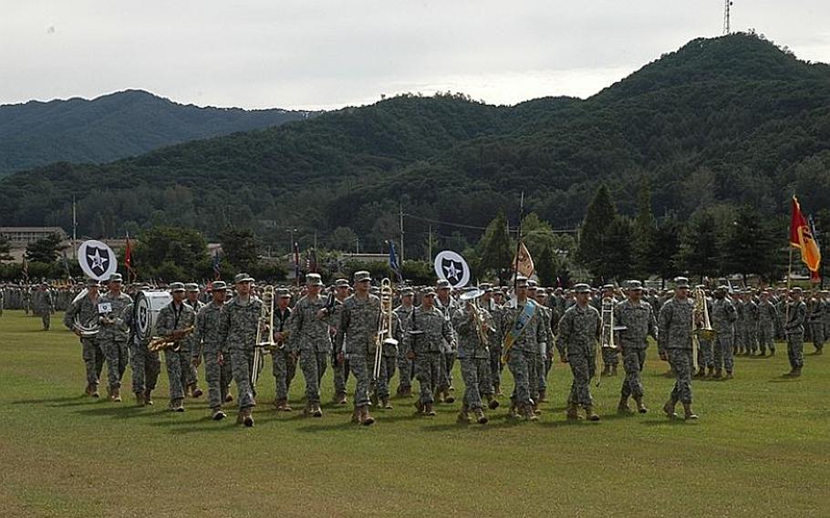 The 2nd Infantry Division Band marches at a change of command ceremony at Camp Casey in South Korea in September 2011. Local officials are upset over reports the U.S. military is lobbying to leave a brigade behind when American troops consolidate south of Seoul in 2016.