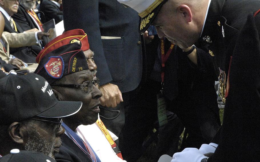 Montford Point Marines are presented with replicas of the Congressional Gold Medal during a ceremony at Marine Barracks Washington on June 28, 2012.