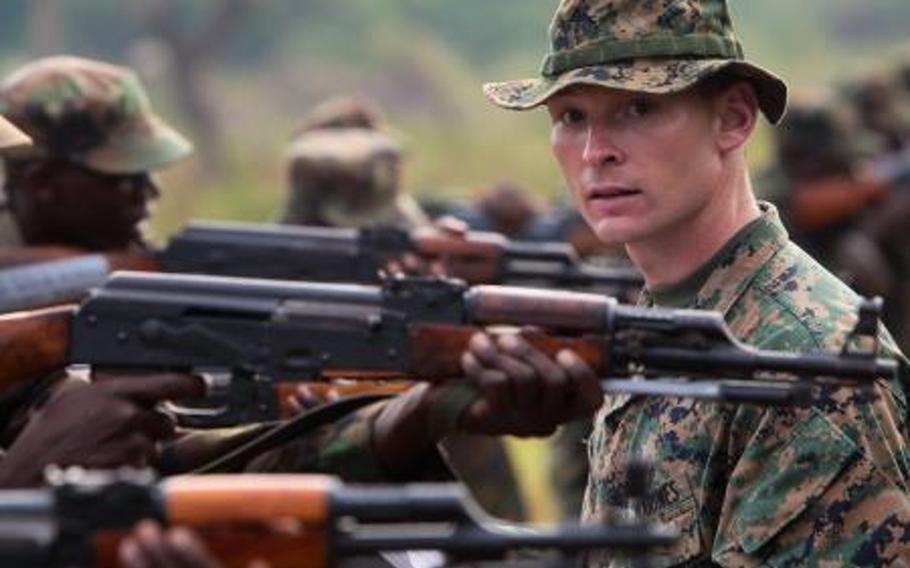 Marine Sgt. Joseph Bergeron, a task force combat engineer, explains combat marksmanship tactics to a group of Ugandan soldiers Feb. 27, 2012. Among its duties, the task force trained Ugandan forces in the hunt for Joseph Kony and the Lord’s resistance army, which is behind a spike in violence in central Africa.