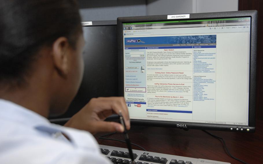 An airman logs into myPay to check her leave and earnings statement for her paycheck at Shaw Air Force Base, S.C.