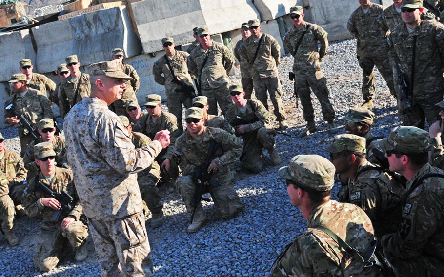 Gen. John R. Allen, International Security Assistance Force commander, speaks with troops gathered at Combat Outpost Jannat in southern Afghanistan on Dec. 25, 2012.
