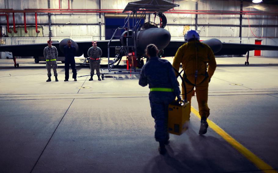 Maintenance personnel from the 9th Aircraft Maintenance Squadron standby as Capt. Travis and Staff Sgt. Heather Doyle prepare the cockpit of a U-2 Dragon Lady, Jan. 8, 2013, at Beale Air Force Base, Calif. It takes dozens of personnel to prepare, launch and recover each of the 33 U-2s assigned to Beale Air Force Base. 
