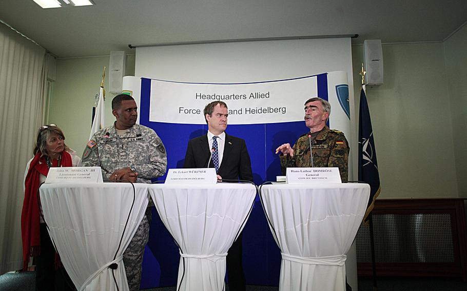 U.S. Army Lt. Gen. John W. Morgan III, commander of NATO's Headquarters Allied Force Command Heidelberg;  Heidelberg Mayor Eckart Wurzner; and German Gen. Hans-Lothar Domrose, commander of NATO's Allied Joint Force Command Brunssum, answer questions at a press conference Thursday after the deactivation of Morgan's unit, a fixture in NATO --- though under many different names --- for 61 years.
