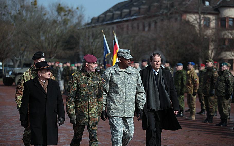 Dignitaries pass troops at the deactivation Thursday of NATO's Allied Force Command Heidelberg. From left, Rudiger Wolf, secretary of state of Germany's Ministry of Defense; German Gen. Hans-Lothar Domrose, NATO's Allied Joint Force Command Brunssum commander; U.S. Army Lt. Gen. John Morgan III, NATO's Headquarters Allied Force Command Heidelberg commander; and Heidelberg Mayor Eckart Wurzner.