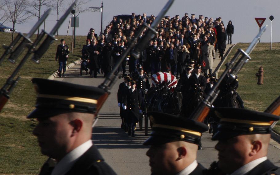 The funeral procession for Army Capt. Andrew M. Pedersen-Keel winds through Arlington National Cemetery on March 27, 2013. Pedersen-Keel was killed March 11 in an insider attack in Afghanistan.