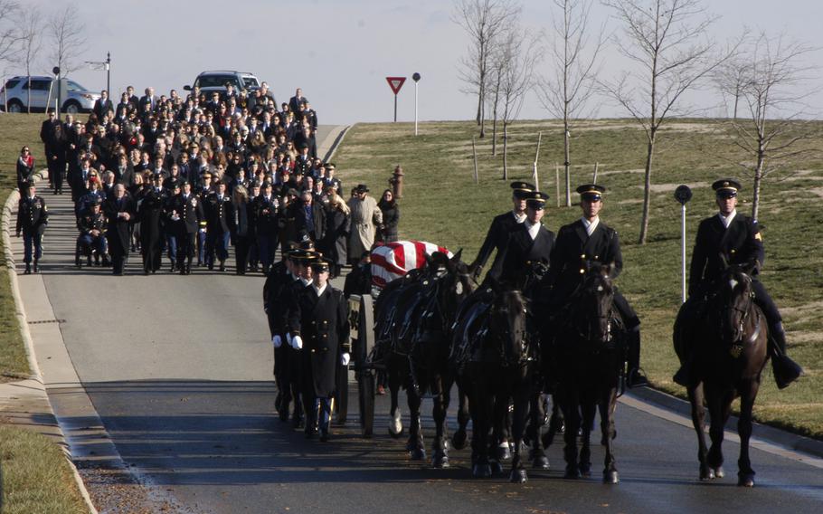 The funeral procession for Army Capt. Andrew M. Pedersen-Keel winds through Arlington National Cemetery on March 27, 2013. Pedersen-Keel was killed March 11 in an insider attack in Afghanistan. 