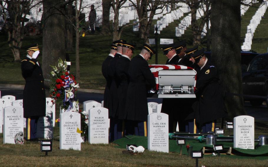 The casket of Army Capt. Andrew M. Pedersen-Keel is lowered to the ground at Arlington National Cemetery on March 27, 2013. Pedersen-Keel was killed March 11 in an insider attack in Afghanistan.