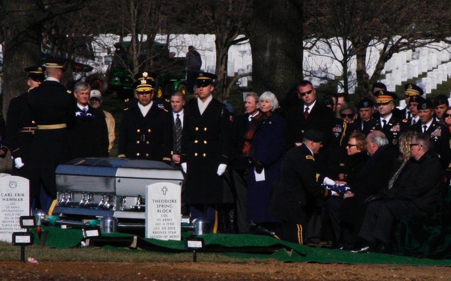 Brig. Gen. Christopher K. Haas, commander, U.S. Special Forces Command, presents the flag that had been draped over the casket of Army Capt. Andrew Pedersen-Keel to the slain soldier's mother, Helen Keiser-Pederson, at Arlington National Cemetery on March 27, 2013. Pedersen-Keel was killed March 11 in an insider attack in Afghanistan.
