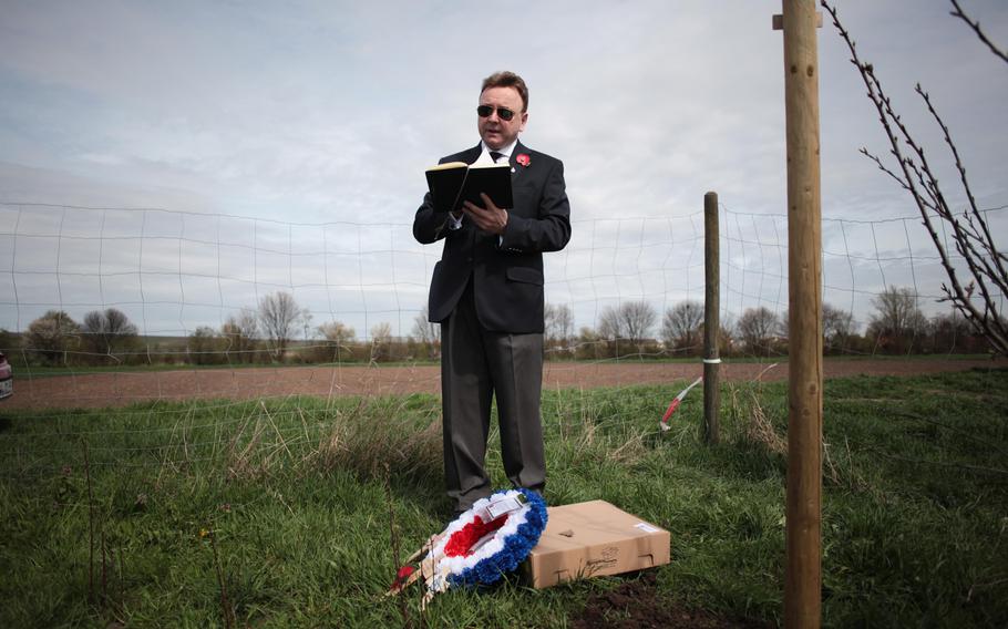 On the 70th anniversary of the crash of British Lancaster bomber ED 427, Englishman Paul Keeley, a friend of the pilot's family, conducts a short ceremony at the crash site in southwestern Germany before laying a wreath and small wooden crosses from some of the surviving families.
