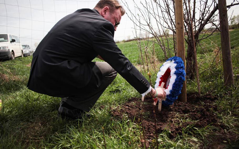 On the 70th anniversary of the crash of British Lancaster bomber ED 427 in Germany, Englishman Paul Keeley, a friend of the pilot's family, lays a wreath and small wooden crosses at the crash site from some of the surviving families.

