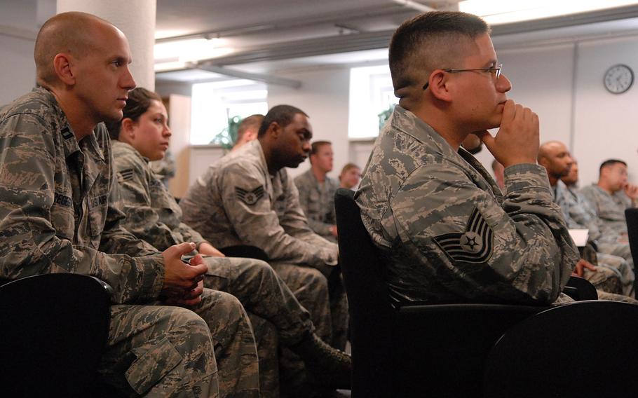 Airmen listen during a ceremony Tuesday at the Air Force Deployment Transition Center on Ramstein Air Base, Germany. The center, the only of its kind in the Defense Department, has supported more than 6,000 servicemembers since opening its doors in July of 2010.