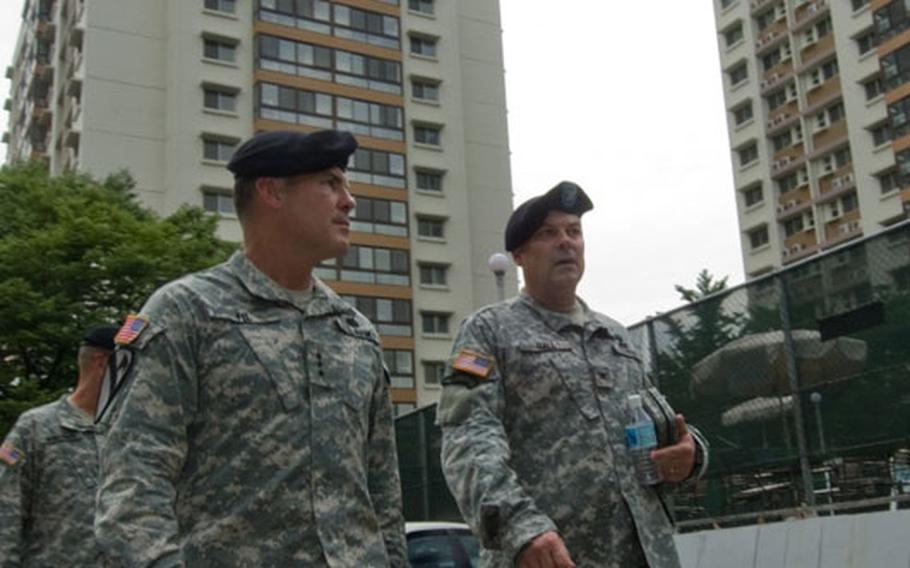 Eighth U.S. Army Commander Lt. Gen. Joseph F. Fil, Jr. (left) receives a tour of Hannam Village leased housing from USAG-Yongsan Commander Col. Dave Hall July 10. Many enlisted servicemembers and junior-grade officers reside at Hannam Village and work at nearby Yongsan Garrison in Seoul.