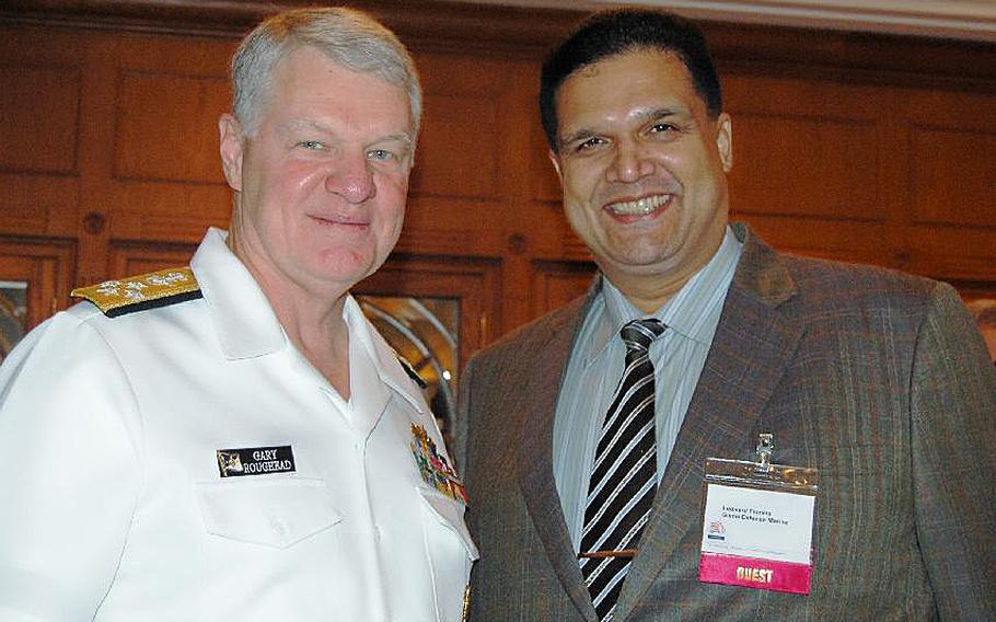 In this undated file photo, former Chief of Naval Operations Adm. Gary Roughead poses with Leonard Glenn Francis, also known as 'Fat Leonard,' who admitted to bribing Navy officials with cash, luxury travel and prostitutes for classified or inside information that benefited his firm. Roughead has not been implicated in the case.