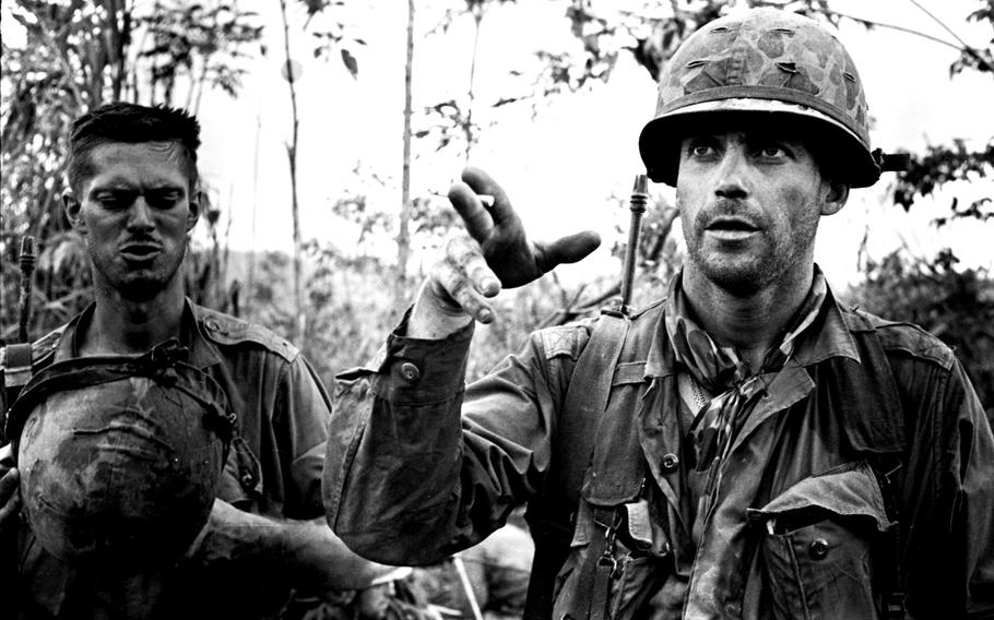 Capt. William Carpenter, right, commander of the 101st Airborne Division's C Company, 2nd Battalion, 502nd Regiment, talks about his company's recent close call in escaping from near-encirclement by North Vietnamese forces during Operation Hawthorne in 1966.