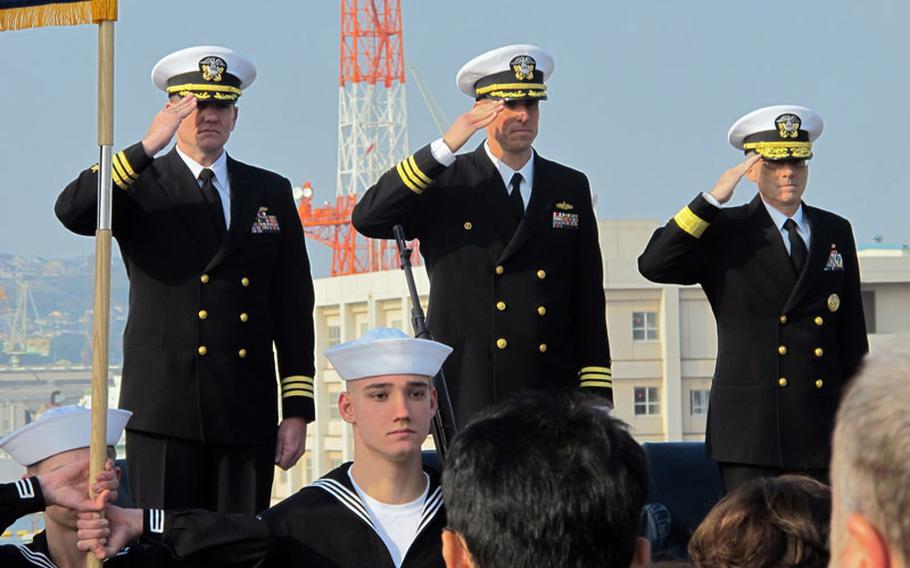 Cmdr. Douglas Patterson, left, took command of the Whidbey Island-class amphibious dock landing ship USS Ashland in Sasebo on Friday, Jan. 17, 2014, from outgoing skipper Cmdr. John Barnett, center. Patterson previously served as the Ashland’s executive officer and now becomes its 16th commanding officer. At right is Rear Adm. Hugh Wetherald, commander of the U.S. Navy's 7th Fleet amphibious forces.