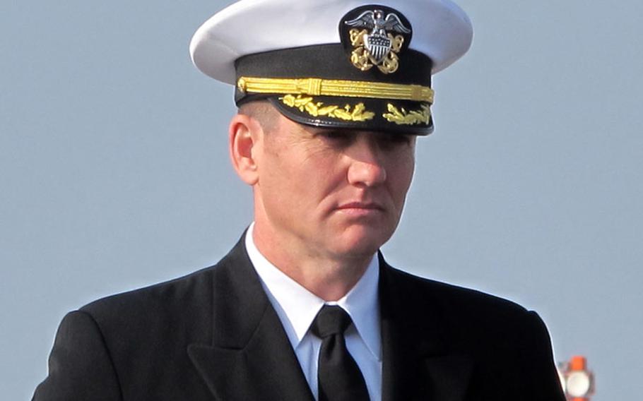 Cmdr. Douglas Patterson took command of the Whidbey Island-class amphibious dock landing ship USS Ashland during a change-of-command ceremony Friday, Jan. 17, 2014, at Sasebo Naval Base, Japan.