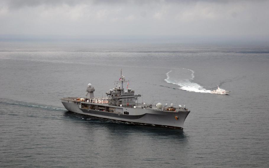 The U.S. 6th Fleet flagship USS Mount Whitney, left, gets underway with the Georgian coast guard ship Sokhumi P-24 in November 2013. 