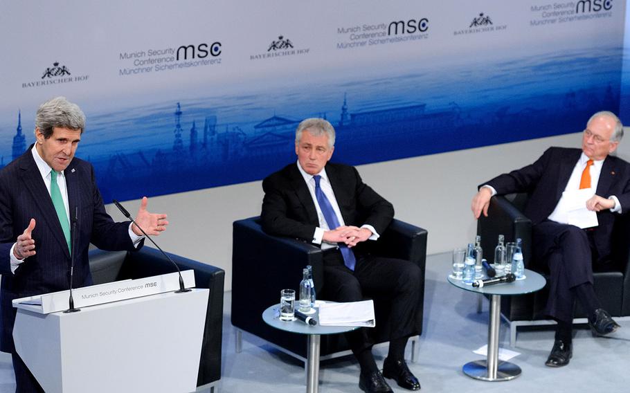 U.S. Secretary of State John Kerry, left, speaks as Secretary of Defense Chuck Hagel and Wolfgang Ischinger look on during the Munich Security Conference. Both U.S. officials energetically refuted concerns by some that the U.S. is “withdrawing” not only from Afghanistan, but into isolationism.