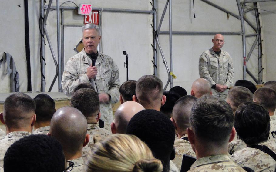 The Marine Corps commandant, Gen. James Amos, and Sgt. Maj. Of the Marine Corps Micheal P. Barrett, talk to Marines on Feb. 18, 2014 at Camp Leatherneck, in Helmand province, Afghanistan.