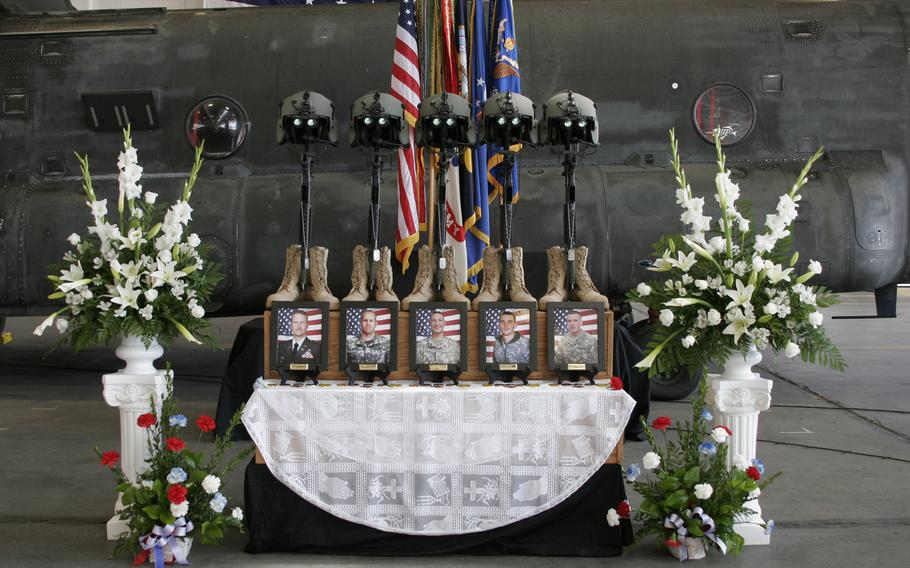 A memorial for five U.S. soldiers killed Aug. 6 in a CH-47 Chinook helicopter crash stands in a hangar in Olathe, Kan., on Aug. 14 at a ceremony honoring them. Killled were Chief Warrant Officer 4 David R. Carter, Chief Warrant Officer 2 Bryan J. Nichols, Staff Sgt. Patrick D. Hamburger, Sgt. Alexander J. Bennett and Spc. Spencer C. Duncan.