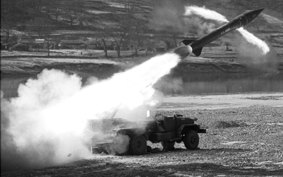 An Honest John missile streaks away from its launcher, bound for a target 13 miles away, during testing in Korea in 1969.