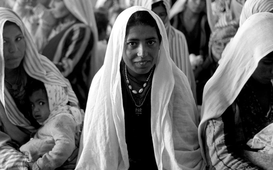 Women and children wait their turn at the dispensary at Camp Jabaliya, one of the refugee settlements on the Gaza Strip, in February, 1958.