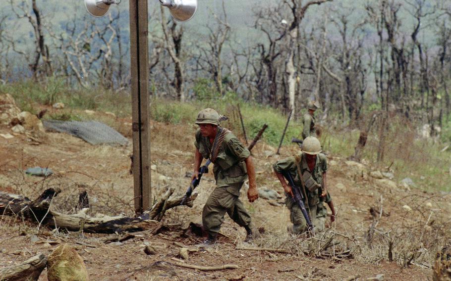 Soldiers return from a patrol on Nui Ba Den (Black Virgin Mountain), Vietnam, in 1969.