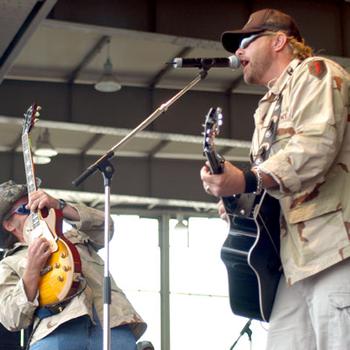 Toby Keith, right, and Ted Nugent perform “Who’s Your Daddy” in 2004 at Illesheim, Germany, during a free Memorial Day concert for soldiers and families. The event was open to military communities across Europe, and most bases offered free bus transportation to the site.