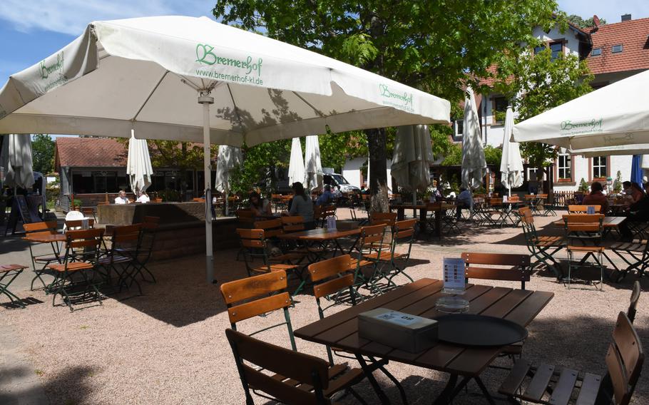 Customers enjoy the warm spring weather at the Bremerhof beer garden in Kaiserslautern, Germany, while sitting at tables spaced widely apart and no more than six per table. The restaurant, located in the woods just south of Kaiserslautern, opened in mid-May. Strict social distancing and hygienic rules are in place to reduce exposure to the coronavirus.