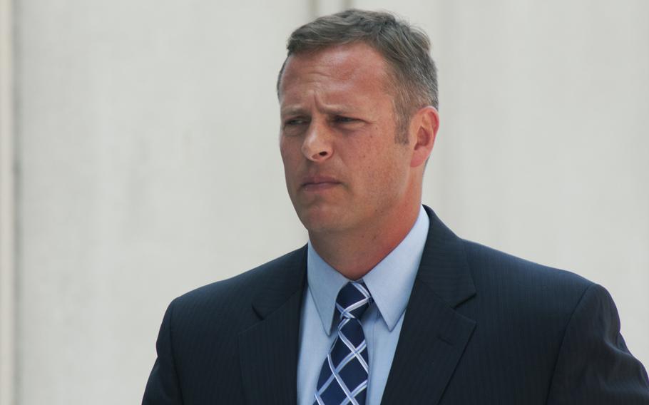 Lt. Col. Jeffrey Krusinski, formerly the Air Force's point man on sexual assault prevention programs, arrives at the Arlington County courthouse on July 18, 2013. The Air Force has decided to punish Krusinski by issuing him a letter of reprimand rather than pursue a court-martial, according to an Air Force document obtained by Stars and Stripes.