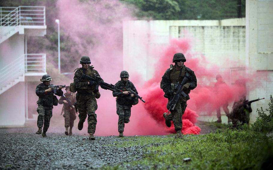 Republic of Korea and U.S. Marines advance through a haze of smoke on June 12, 2014, at a training center in Pohang, Republic of Korea. Defense officials announced Thursday, Sept. 4, 2014, that the U.S. and South Korea will form a combined division early next year to improve the allies’ warfighting capabilities and create more opportunities for efficient joint training.