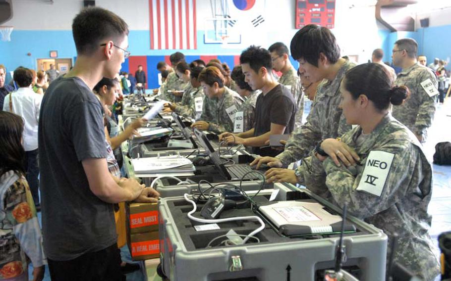 U.S. military dependents, contractors, retirees in Area 4 participate in the Courageous Channel exercise at the Kelly Fitness Center on Camp Walker, South Korea, in May 2012.