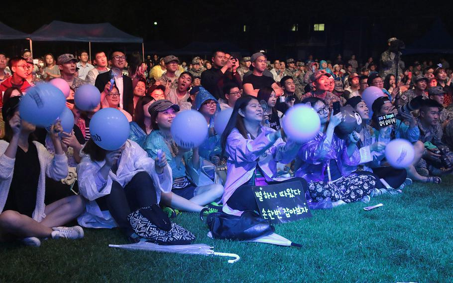 Crowd members watch the group "One Mind," perform at Camp Red Cloud, South Korea, on Sept. 3, 2014. Uijeongbu City and Gyeonggi Province officials hosted the concert dedicated to the 2nd Infantry Division, but Uijeongbu mayor Ahn Byung Yong boycotted the event in protest of recent incidents, including an attack on a local taxi driver, purportedly involving U.S. servicemembers.
