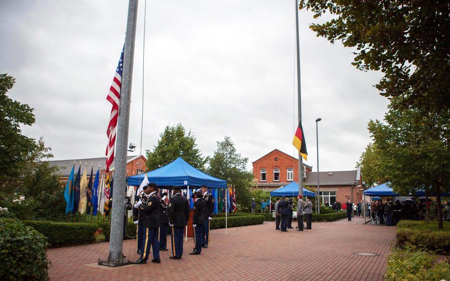 American and German color guards lower their countries' flags to mark the end of the U.S. presence in Bamberg, Germany, during a ceremony Friday, Sept. 12, 2014.

