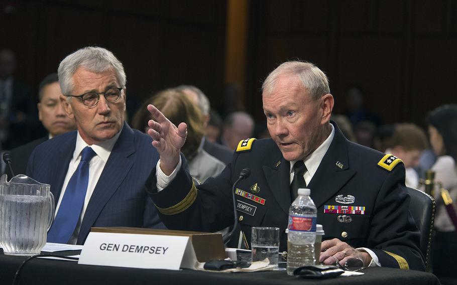 Secretary of Defense Chuck Hagel and Chairman of the Joint Chiefs of Staff Gen. Martin E. Dempsey testify before the Senate Armed Services Committee in Washington D.C. on Tuesday Sept. 16, 2014. Senate lawmakers were to vote Thursday, Sept. 18, 2014, on a measure authorizing military strikes in Syria targeting the Islamic State terrorist group.