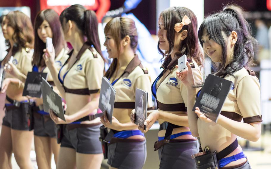 Girls for G-Cluster advertise the mobile game ''ZOIDS Material Hunters'' at the Tokyo Game Show in Makuhari, Japan Sept. 18, 2014. The game will be available in Japan on iOS and Android next spring.