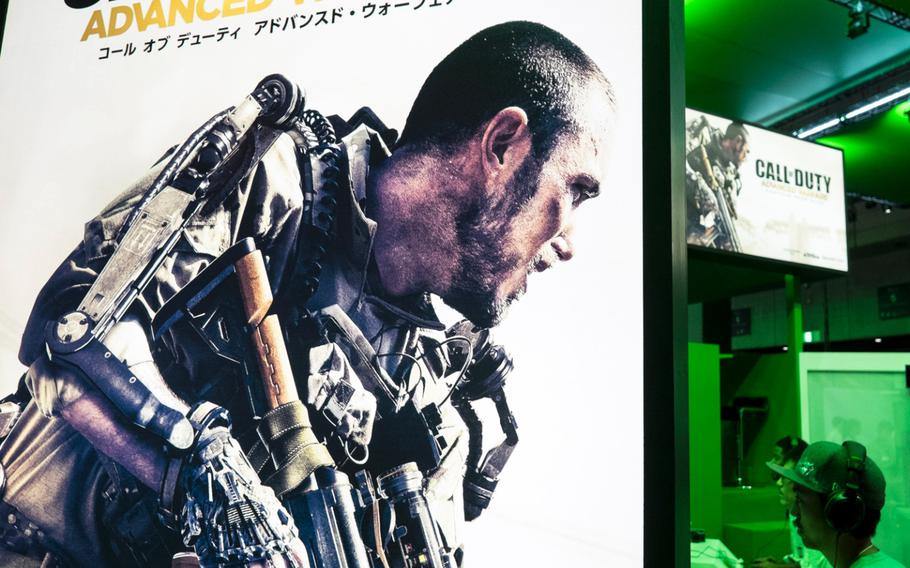 Members of the media get a sneak peak at the pre-release copy of ''Call of Duty: Advanced Warfare'' on XBox One at the Tokyo Game Show on Sept. 18, 2014, in Makuhari, Japan.