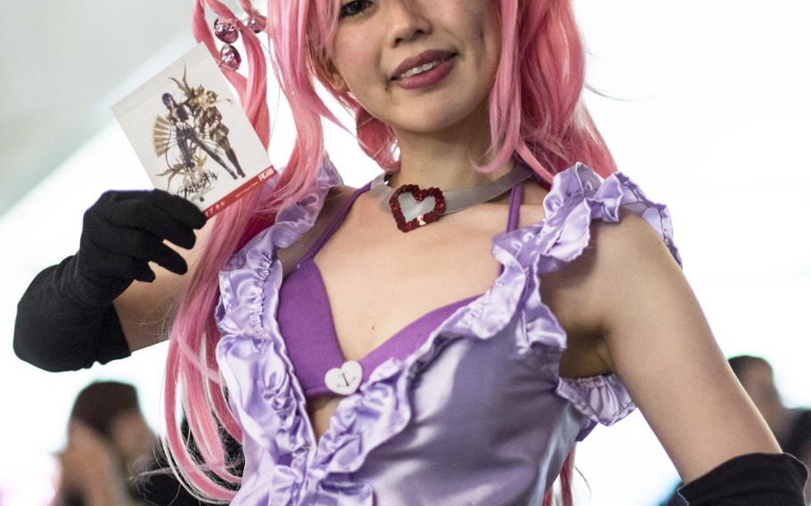 A cosplay actress from Fuji and Gumi Games advertises the game developer's new game, ''Phantom of the Kill,'' at the Tokyo Game Show Sept. 18, 2014, in Makuhari, Japan.