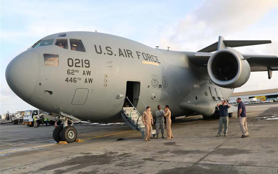 A C-17 arrives in Liberia on Thursday, Sept. 18, 2014, with the 1st shipment of increased U.S. military equipment and personnel in the fight against the spread of Ebola in West Africa. The cargo included a forklift, drill set and generator and a team of 7 military personnel, including engineers and airfield specialists.