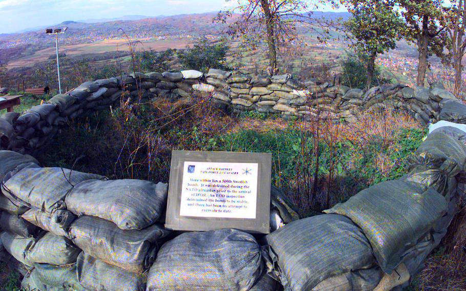 Sandbags surround the site of an unexploded 500-pound bomb on Mount Vis in 1998.