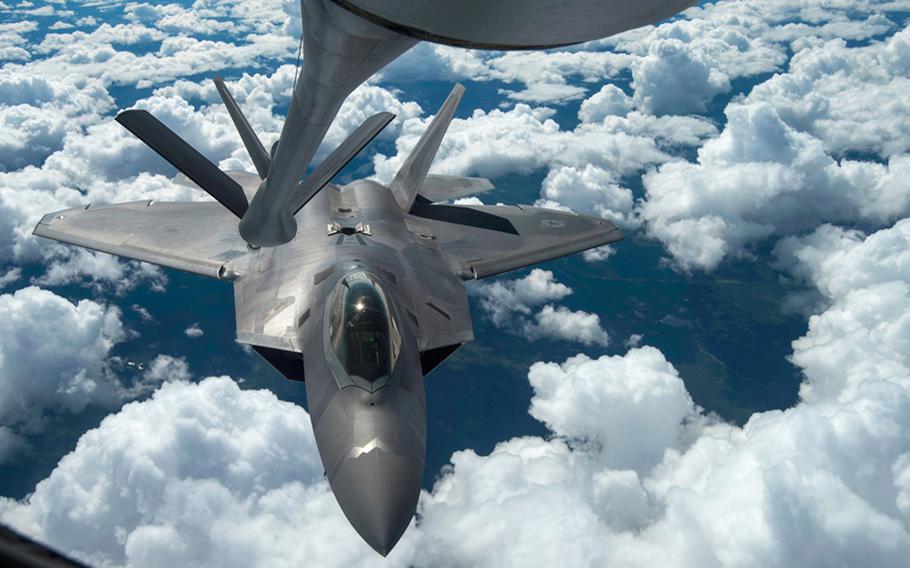 An F-22 Raptor performs a refueling with a KC-135 Stratotanker during a training mission Aug. 7, 2014, near Joint Base Elmendorf-Richardson, Alaska. The F-22 is designed to project air dominance, rapidly and at great distances. On Tuesday, Sept. 23, 2014, Pentagon officials said Raptors were among the aircraft that flew missions over Syria providing airstrikes against Islamic State militants.
