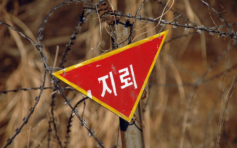A sign warning of land mine danger is seen on Feb. 15, 2008, on the South Korean side of the DMZ.