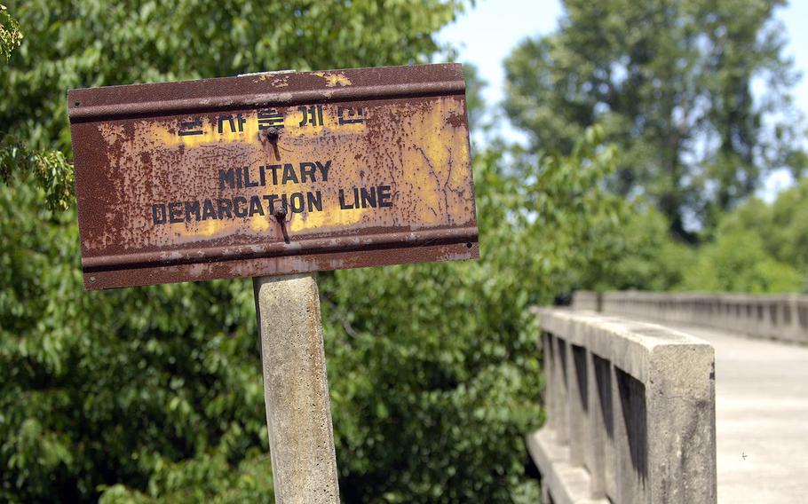 A sign shows the demarcation line at the Bridge of no Return on the South Korean side of the DMZ, on June 16, 2007.