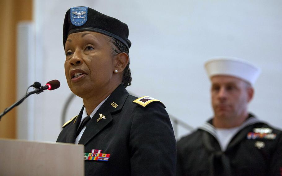 Col. Jacqueline Bradley, commander of the 4215th U.S. Army Hospital, speaks at a ceremony Friday, Sept. 26, 2014, in which her unit took over from the Navy Expeditionary Medical Unit at Landstuhl Regional Medical Center. The NEMU cased its colors in the ceremony and, as a contingency unit made up of reservists and active-duty sailors from various Navy organizations, will disband.