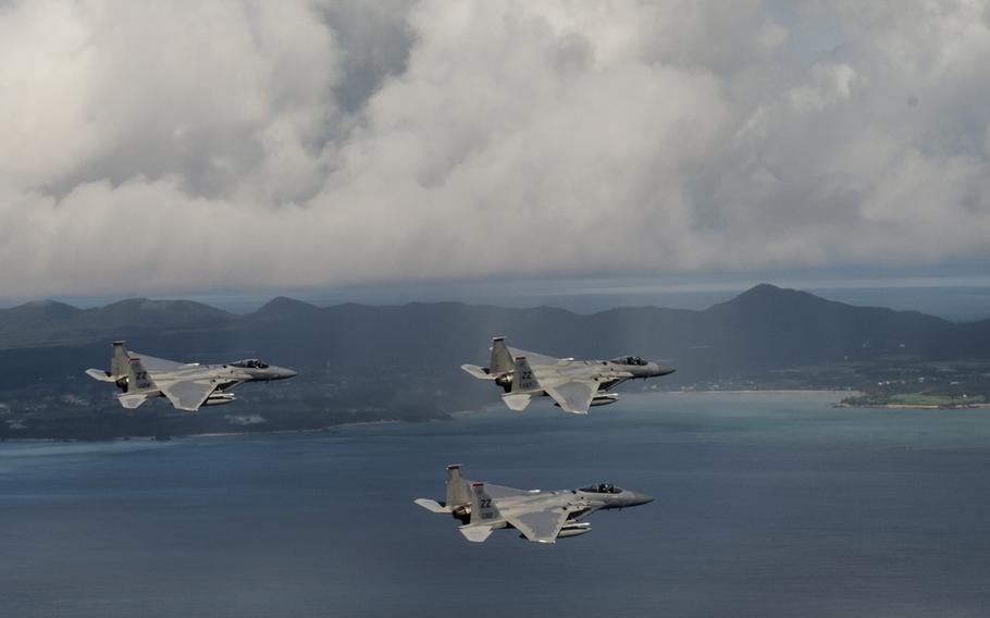 U.S. Air Force F-15 Eagles from the 67th Fighter Squadron fly a training mission over the Pacific Ocean outside of Kadena Air Base, Japan, Aug. 25, 2014. The F-15 is celebrating 35 years at Kadena on Monday. 