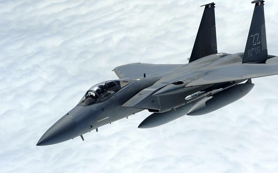 A U.S. Air Force F-15 Eagle from the 67th Fighter Squadron breaks away from a 909th Air Refueling Squadron KC-135 Stratotanker over the Pacific Ocean, Oct. 28, 2013. 