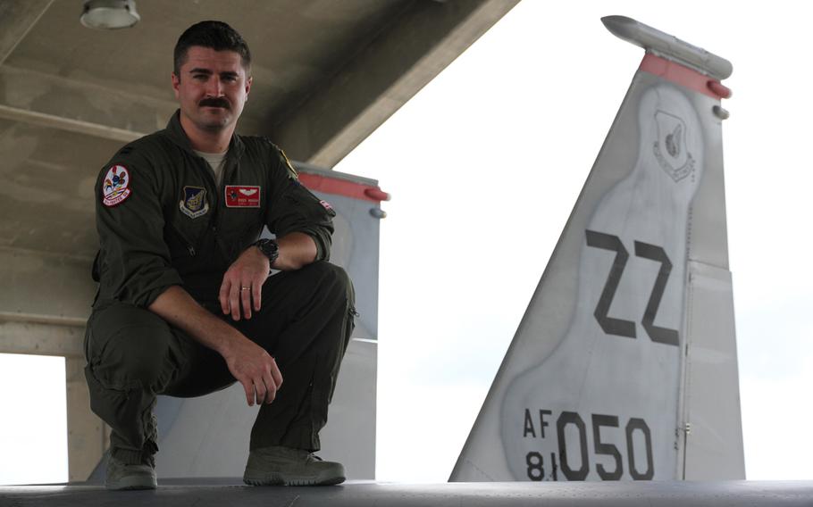 Air Force Capt. Jonathan ''River'' Mahan of the 67th Fighter Squadron pauses for a moment atop his F-15C Eagle at Kadena Air Base last week. 